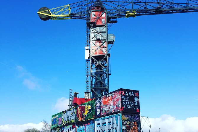 Amsterdam's Hidden Gems and Street Art Bike Tour - NDSM Wharf and the graffiti focus: industrial art, big halls, and cranes
