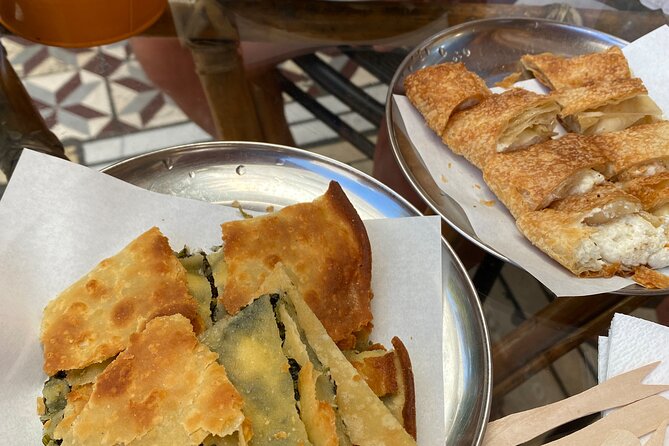 Athens Food and Wine Walk from Street Art to Greek Dinner - “Magnificent statues” pause: a quick culture moment you can’t skip