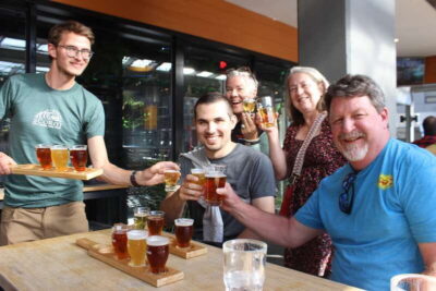 Calgary: Street Art & Craft Beer Walking Tour w/ Tastings - Bottlescrew Bills Pub: beer tasting with mural momentum