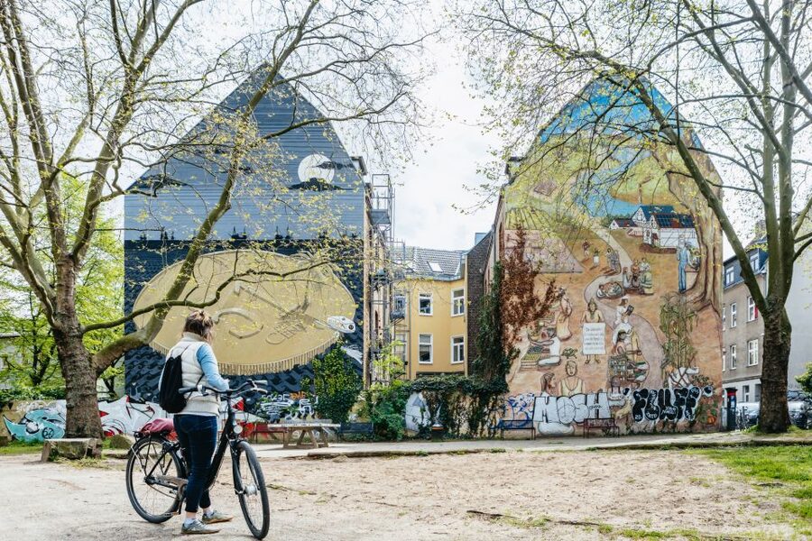 Cologne: Ehrenfeld Street Art Bike Tour - Getting your bike: helmet, poncho, and the City Bike setup