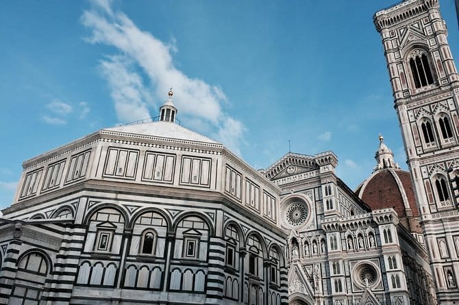 Discover Florence: Uffizi and Accademia Gallery small-group tour - The guided walking tour ends at a major basilica area