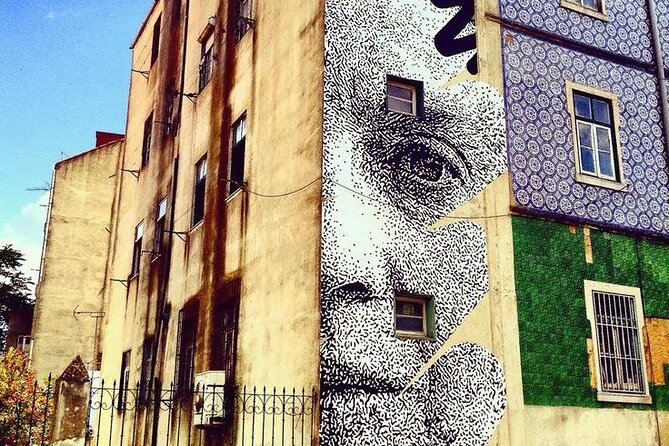 Lisbon Street Art - Private Guided Tour in a Electric Tuk Tuk - Stop 2: Shepard Fairey x Vhils and the iconic Peace Guard