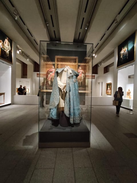 Madrid: Guided Tour of the Royal Collections Gallery - Bourbon level: furniture, clocks, a 19th-century carriage, and wartime photography