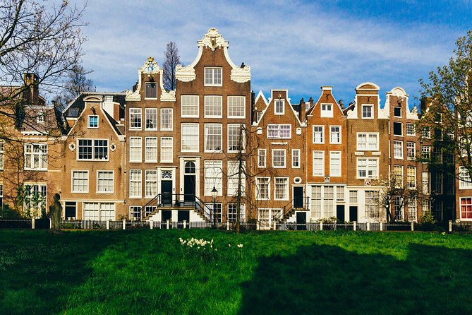 Private City Kickstart Tour: Amsterdam - Bloemenmarkt to Begijnhof: Flowers, Mini-Worlds, and Quiet Medieval Corners