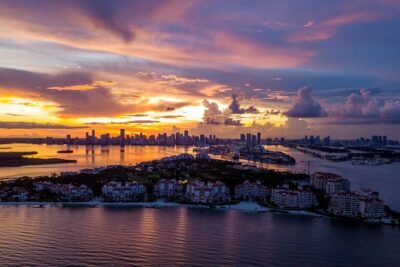 Private Golf Cart Tour of Miami Beach - South Pointe Park: a classic sunset setup with skyline and Fisher Island views