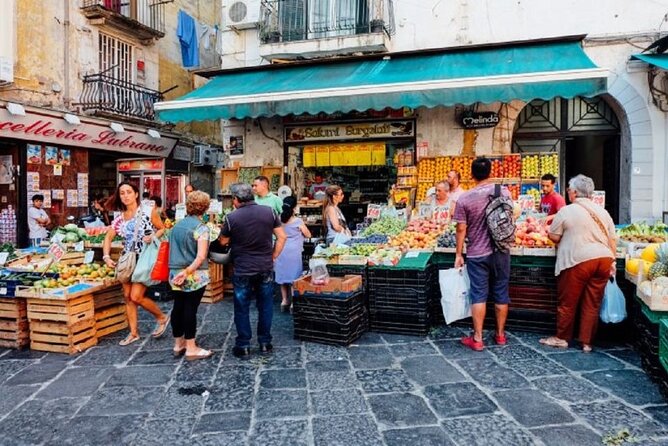 The Spanish Quarters, Street Art and Local Market Tour in Naples - Quartieri Spagnoli: street art, hanging linens, and Maradona murals